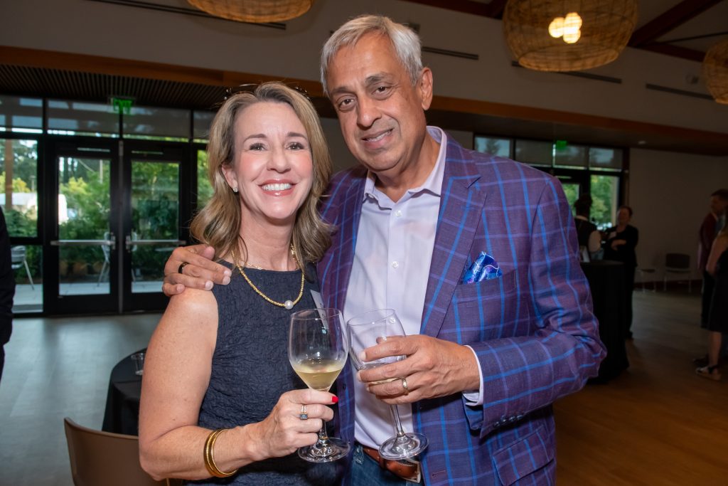 Honoree Neel Chatterjee smiling with an event guest