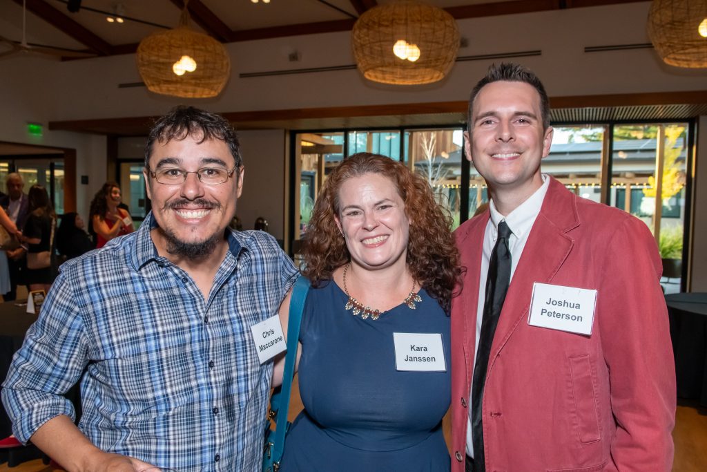 DRA’s Chris Maccarone and Joshua Peterson smiling with DRA Board Treasurer Kara Janssen