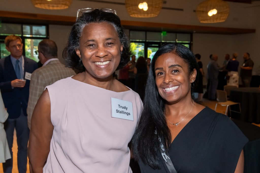DRA's Trudy Stallings smiling with an event guest