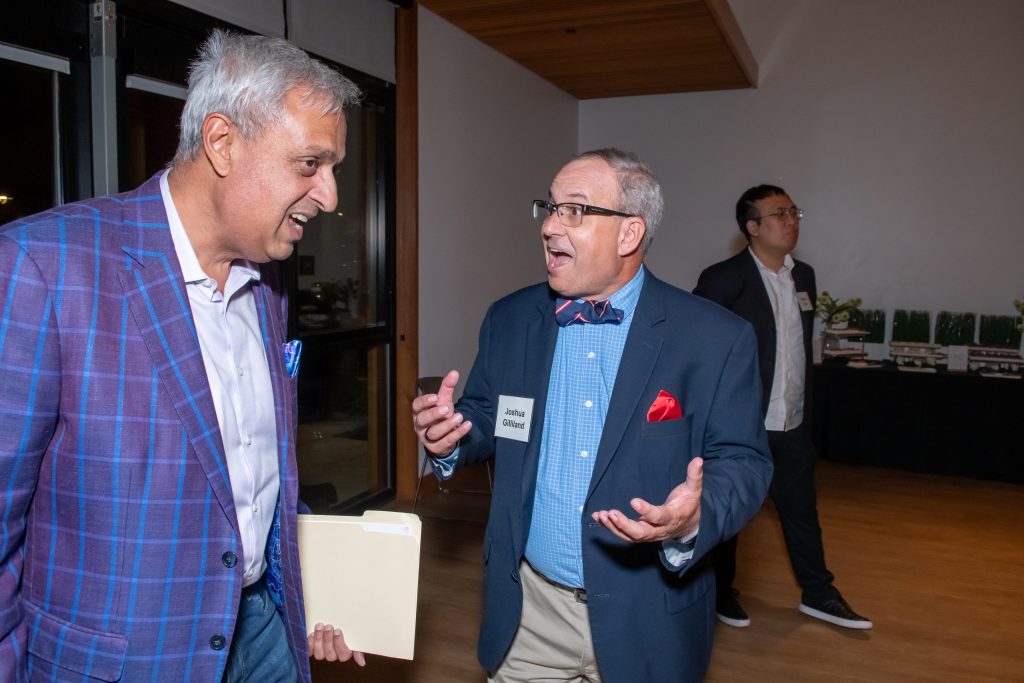 Honoree Neel Chatterjee speaking with an excited event guest