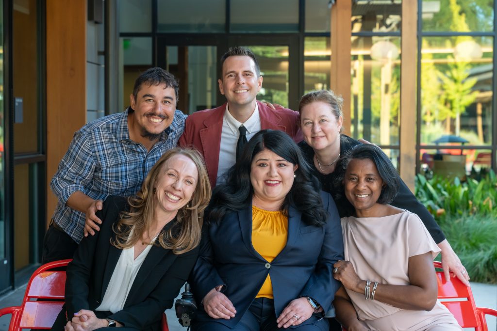 DRA's Chris Maccarone, Joshua Peterson, Shawna Parks, Kate Hamilton, Rebecca Williford, and Trudy Stallings posing and smiling together