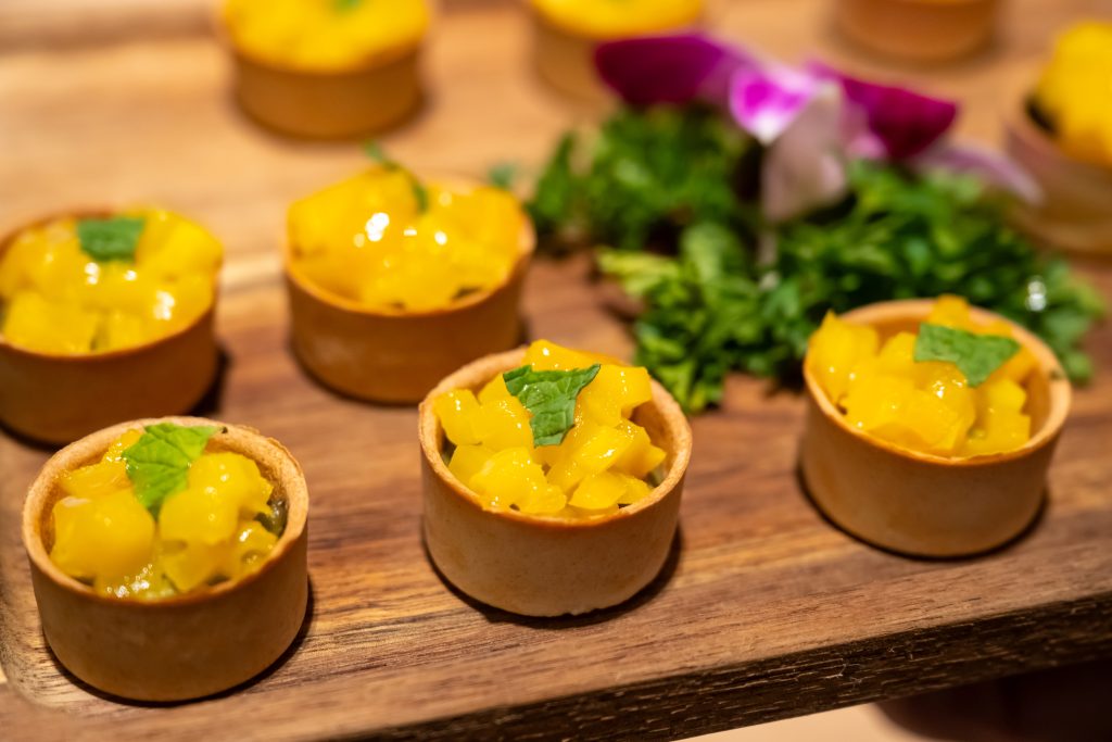 Platter of mango pastry appetizers
